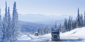 holiday season 2021 truck on snowy road