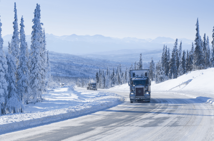 holiday season 2021 truck on snowy road