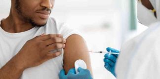 Cropped of black man receiving vaccine shot