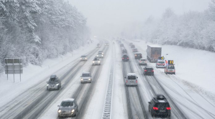 snow covered highway in austria with cars out of focus