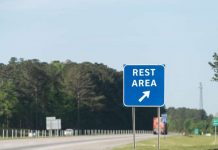 Rest area sign on highway for drivers