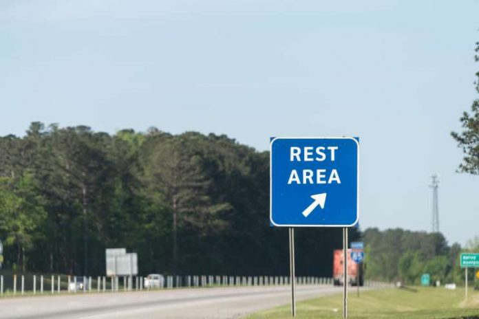 Rest area sign on highway for drivers