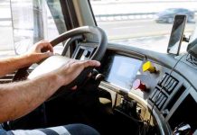 Truck drivers big truck driver's hands on big truck steering wheel