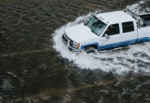 Truck on a flooding highway of BC