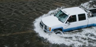 Truck on a flooding highway of BC