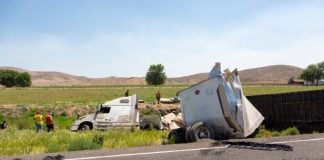 big-rig-dangerous-accident-rural-road-rollover-trucking-semi-truck-road-accident