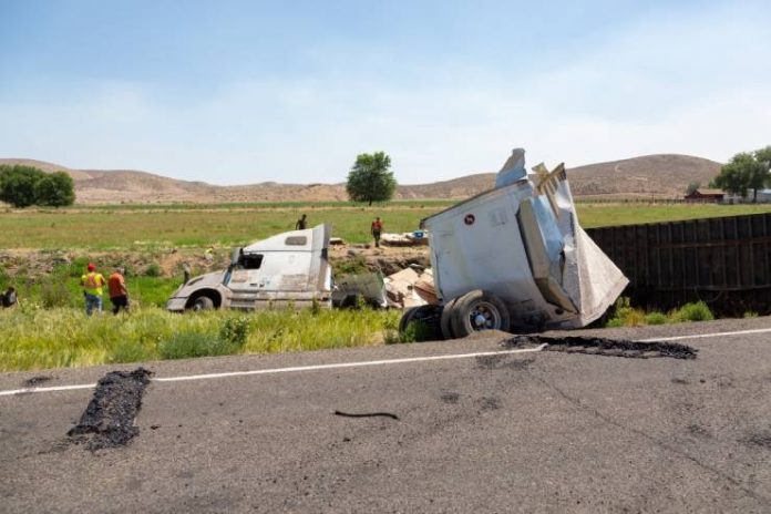big-rig-dangerous-accident-rural-road-rollover-trucking-semi-truck-road-accident