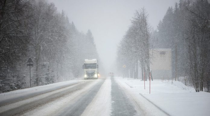 semi truck in a winter snowy highway