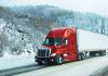 semi-truck on highway in spring thaw season