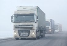 Trucks in fog driving in winter