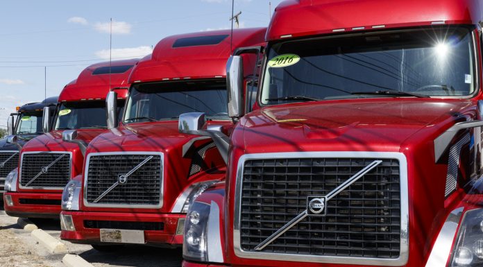 Ft. Wayne - Circa August 2019: Volvo Semi Tractor Trailer Trucks Lined up for Sale. Volvo is one of the largest truck manufacturers VI